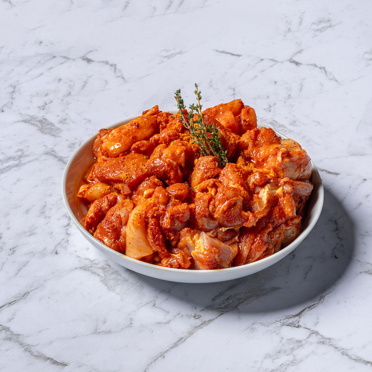 Prepared marinated chicken. Simple bowl.